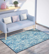 Blue and aqua chevron pattern washable rug.